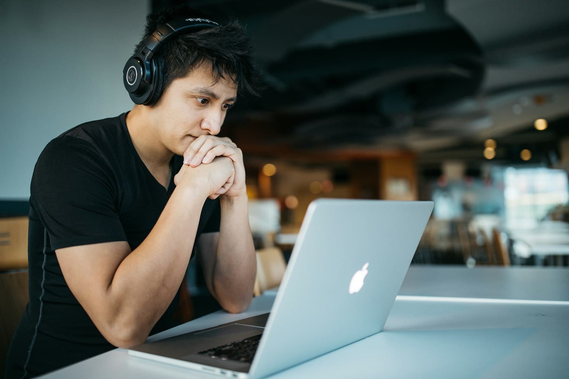 Student taking an online exam with headphones